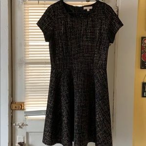 Black and gold fit and flare dress